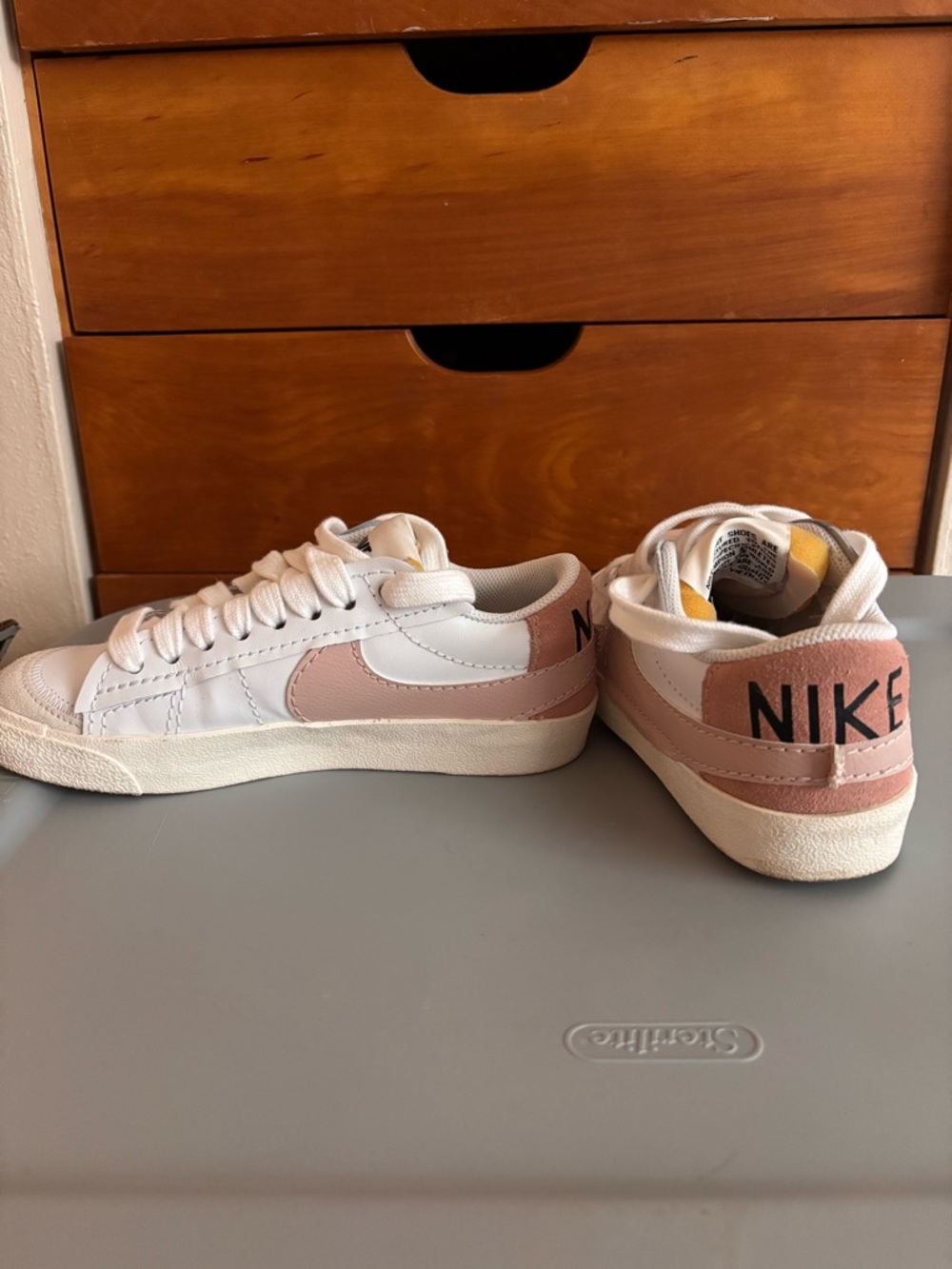Nike White Low-Top Sneakers with Light Pink Swoosh